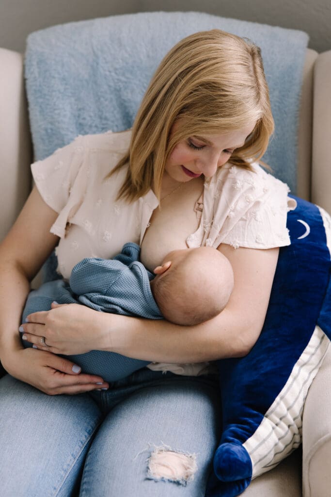 An intimate in-home breastfeeding photography session in San Antonio. Featuring a mother and baby sharing a quiet moment of connection. Captured in natural light, this lifestyle photo highlights the emotional bond and beauty of motherhood. Perfect example of documentary-style breastfeeding photography for families seeking authentic memories at home.
